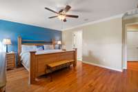 These floors are really nice.  This looks into the hall and the primary bathroom suite.