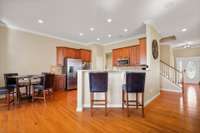 View into kitchen and breakfast area and counter bar from great room.