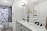 Bathroom 2 upstairs also offers twin vanities and a tub/shower combo. Everything is immaculate and ready for you!