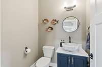 Notice the specialty sink vessel in this adorable half bath...so pretty!