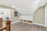 A built-in cabinet provides great storage for games, etc.