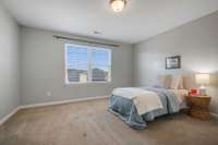 The second and third bedrooms are located on the second story but situated away from primary bedroom. All three bedrooms are very large and all have walk-in closets.