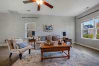 Natural light floods in through the living room windows as well as the doors off of the dining area that lead to the beautiful backyard.