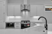 The kitchen island features a convenient barstool overhang - perfect for casual dining, entertaining, or a quick morning coffee.