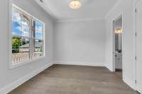 Versatile, main-level bedroom with a Jack-and-Jill connection to Bedroom 3. Perfect as a guest retreat - or easily transformed into a functional home office to fit your lifestyle.