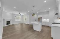 Is someone cooking or enjoying the fireplace? - This open floor plans allows everyone inside the home to be included!