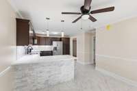 Take a look at this beautiful stacked-stone breakfast bar, contemporary pendant lighting.