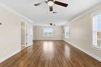 Spacious living room area with sunning wood floors. .