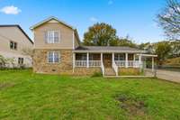 Charming Southern Traditional or Country-inspired design with a long porch.
