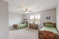 This large bedroom has a double window overlooking the common area out back.