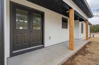 Double back door with covered patio.