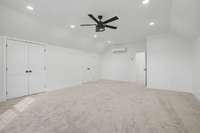 Just 6 steps up to the 4th bedroom or bonus room over garage featuring recessed lighting & plenty of closet space.