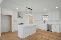 Kitchen island with granite, stainless steel appliances, glass pantry door with craftsman style cabinets is waiting for you.