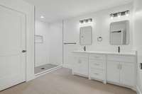 Primary bathroom features double sinks, quartz countertops, tiled shower, toilet room, with gold and black finishes.