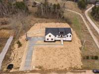 Large lot with side entry garage, paved driveway & turnaround