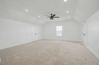Just 6 steps up to the 4th bedroom or bonus room over garage featuring recessed lighting & plenty of closet space.