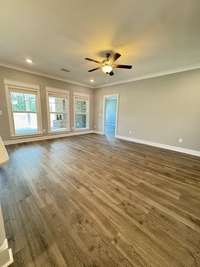 Living room features large windows for ample lighting.

*Photo is from a previous listing displaying the completed floor plan some options and selections may vary from actual home.