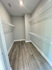 Primary bedroom walk-in closet.

*Photo is from a previous listing displaying the completed floor plan some options and selections may vary from actual home.
