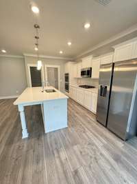 Kitchen. This photo displays a gourmet kitchen upgrade that WILL NOT be in the actual house. Kitchen will feature a standard single gas stove/oven.