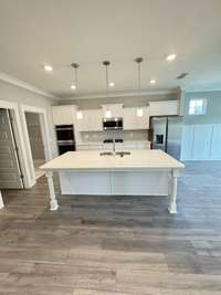 Kitchen. This photo displays a gourmet kitchen upgrade that WILL NOT be in the actual house. Kitchen will feature a standard single gas stove/oven.