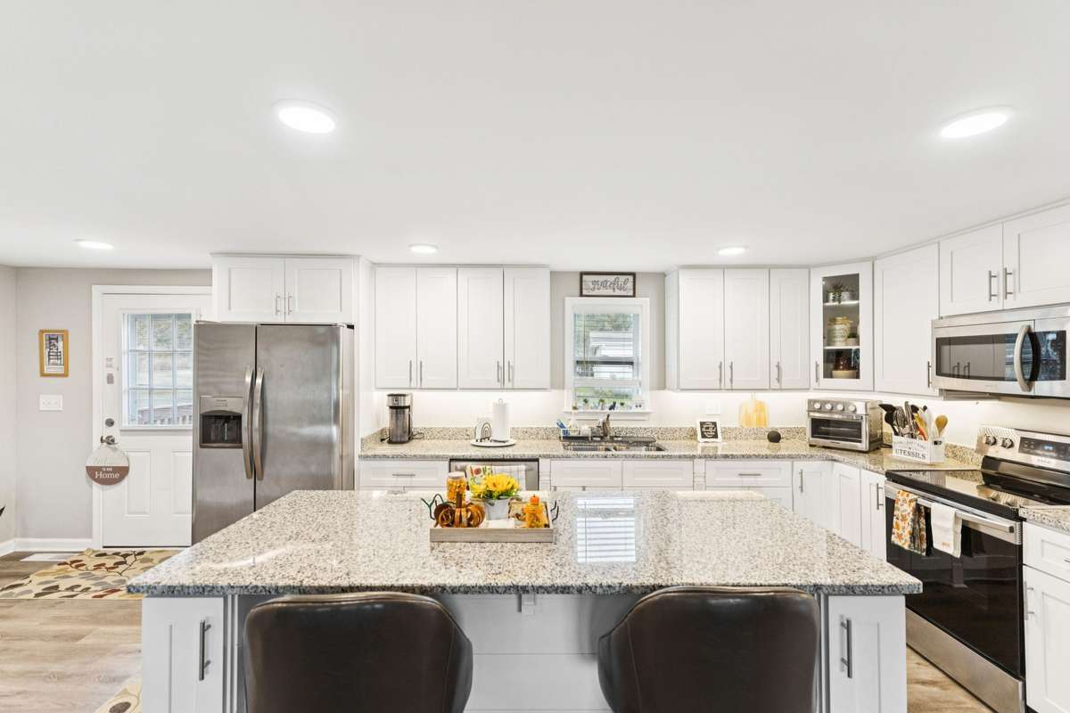 Kitchen offers a large kitchen island with seating.  4775 New Tullahoma Hwy Manchester TN 37355
