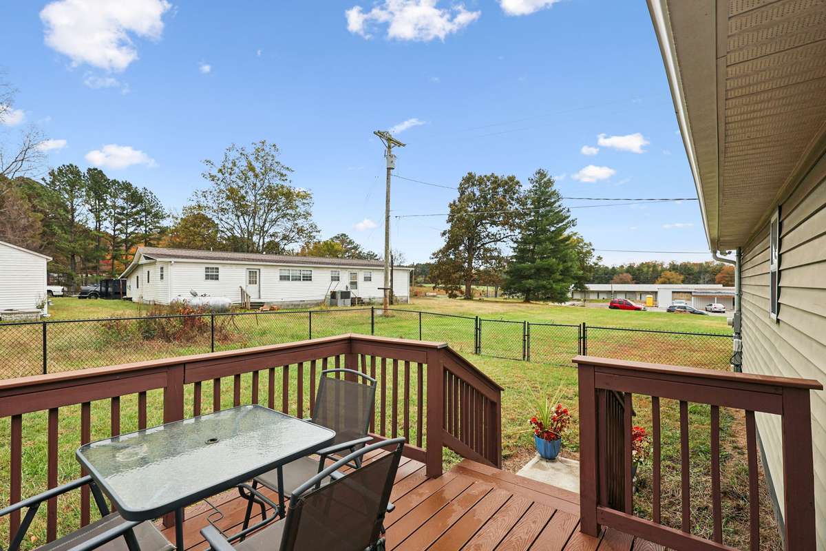 Step out onto your stained back deck.  4775 New Tullahoma Hwy Manchester TN 37355