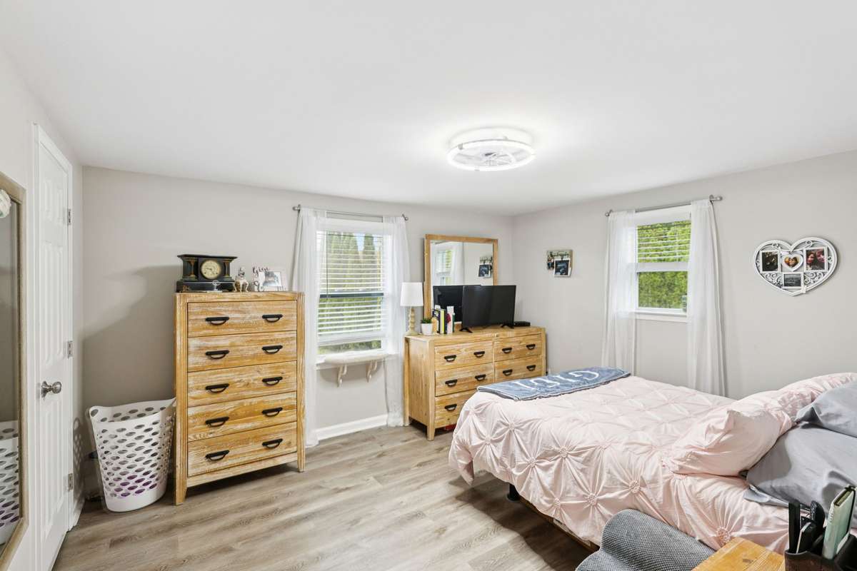 Second bedroom offers two windows and a modern overhead light fixture.  4775 New Tullahoma Hwy Manchester TN 37355