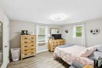 Second bedroom offers two windows and a modern overhead light fixture.  4775 New Tullahoma Hwy Manchester TN 37355