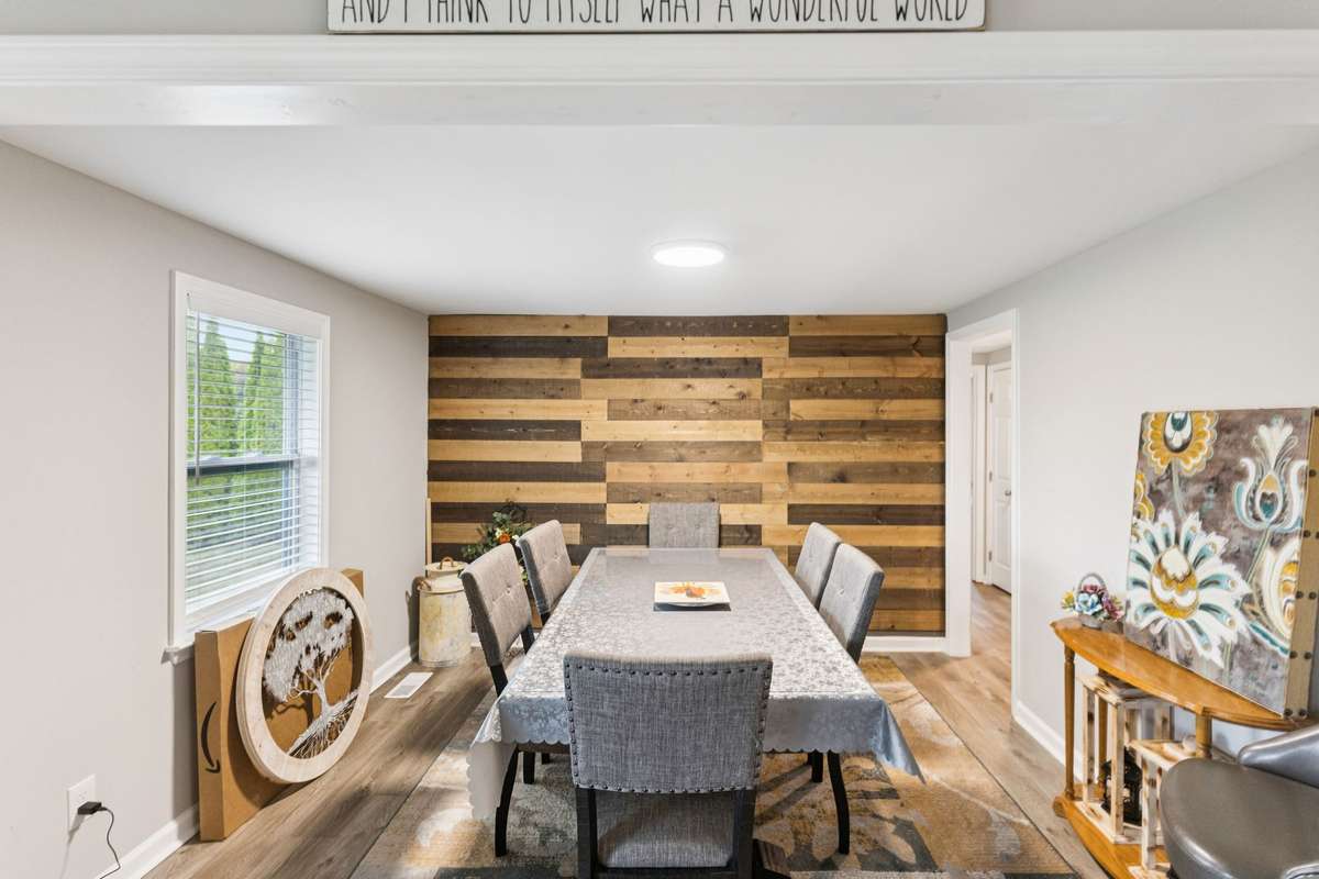 Formal dinning room with a wood accent wall.  4775 New Tullahoma Hwy Manchester TN 37355