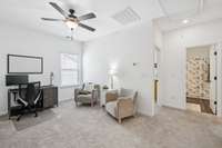 Loft space separates primary bedroom from secondary bedrooms.