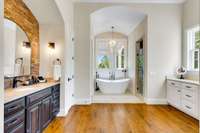 Primary bath view from bedroom hallway