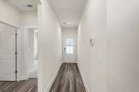 Off the front entryway is a downstairs room and full bath.