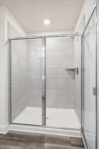 Large, tiled, walk- in shower.