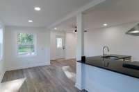 Open living are, modern and stylish color choices and natural light make for an inviting space!