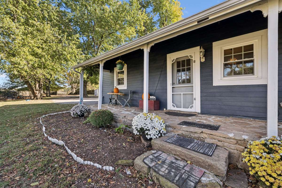 Covered stone front porch.  3007 Fullerton Ln College Grove Tn 37046