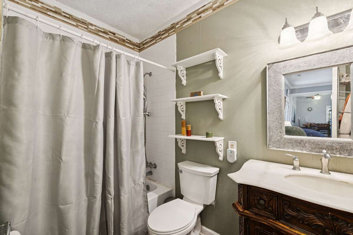 Full bath with a shower/tub combo and a single vanity sink.  3007 Fullerton Ln College Grove Tn 37046