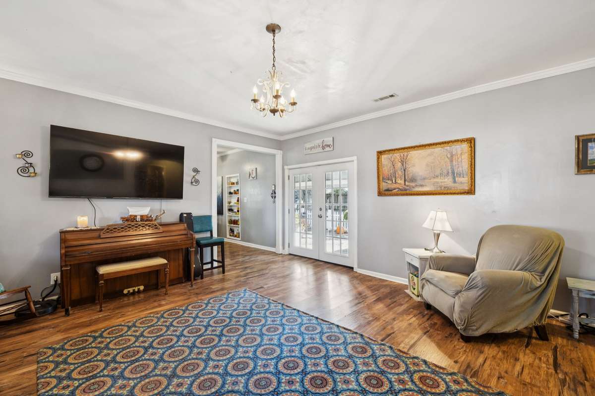 Multiple windows and French doors create multiple sources of natural light.  3007 Fullerton Ln College Grove Tn 37046