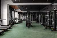 Level 3 - State-of-the-art fitness center featuring a private spin room and a full range of premium equipment for every workout style.