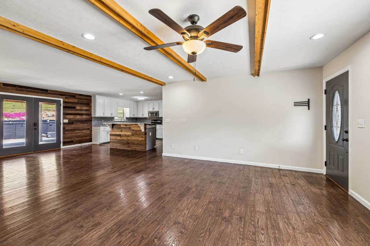 Hardwood floors in the main living area, and bedrooms.
