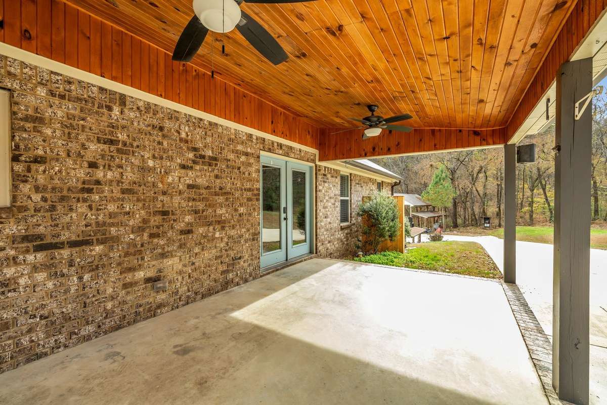 Spacious back porch with tongue & grove ceiling.