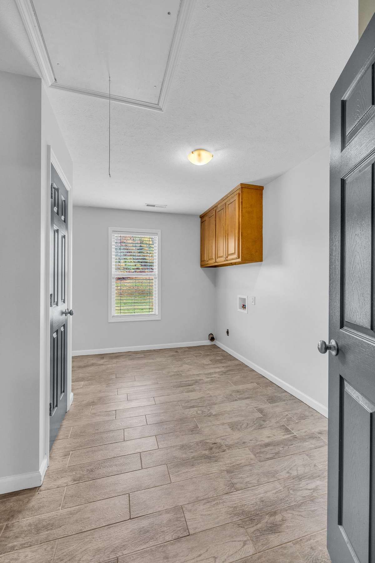 Spacious 13x10 laundry room w/tile flooring.