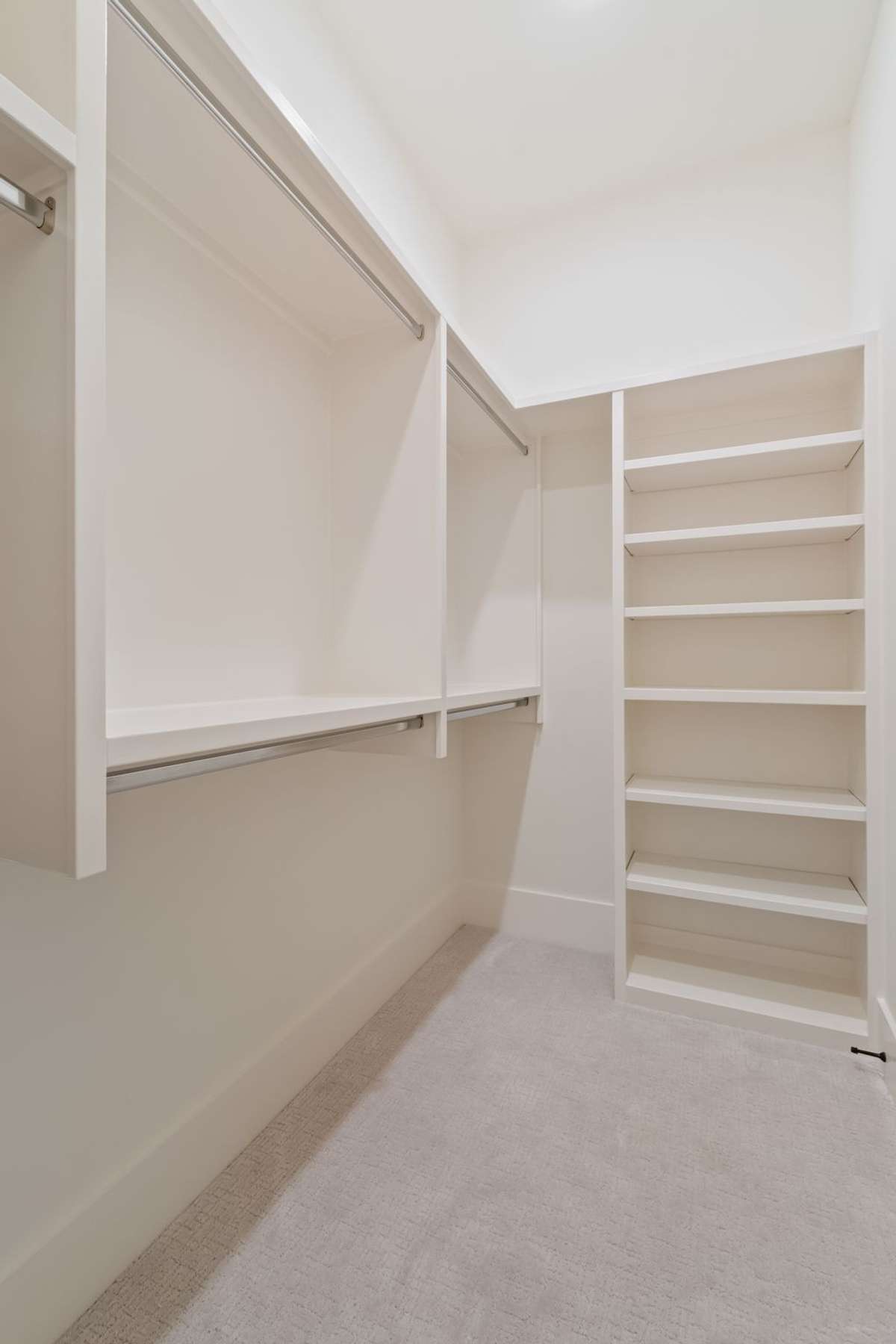 One of three secondary bedrooms upstairs. All bedrooms are ensuite and have generously-sized walk-in closets.