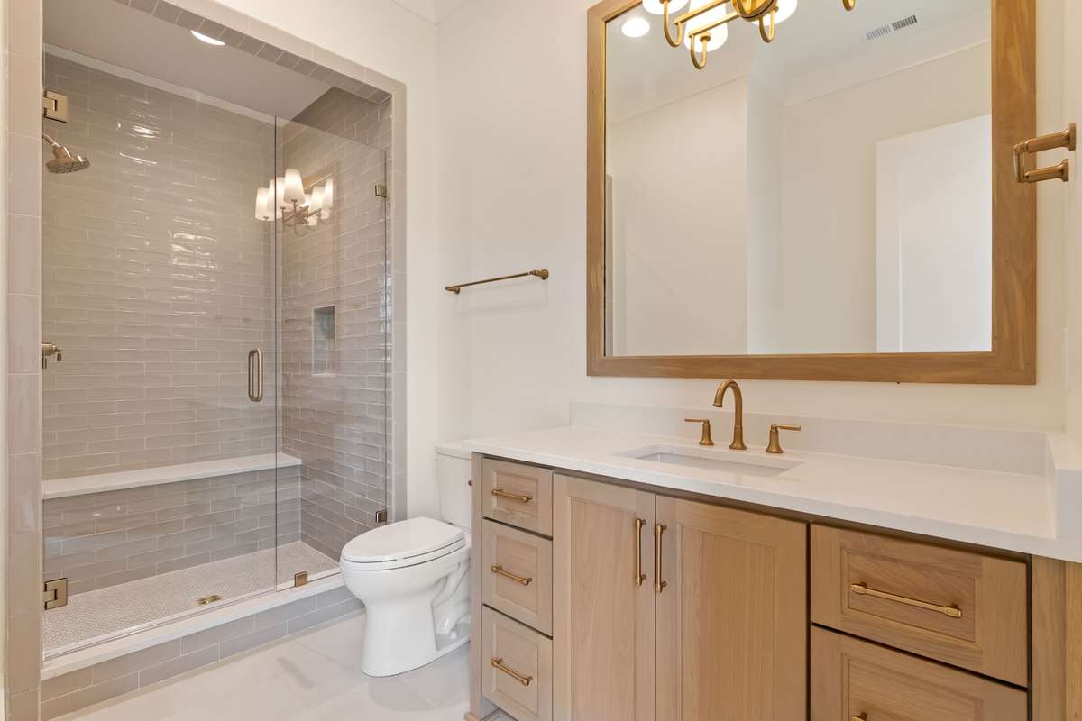 One of three secondary bathrooms upstairs. All bedrooms are ensuite and have generously-sized walk-in closets.