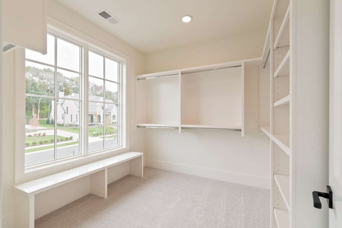 One of three secondary bedrooms upstairs. All bedrooms are ensuite and have generously-sized walk-in closets.