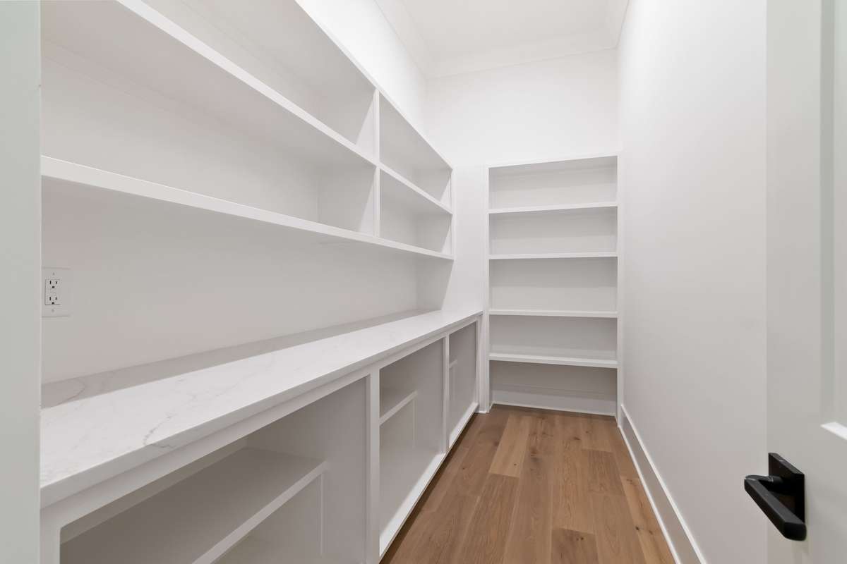 Spacious pantry with work station right off of the Kitchen