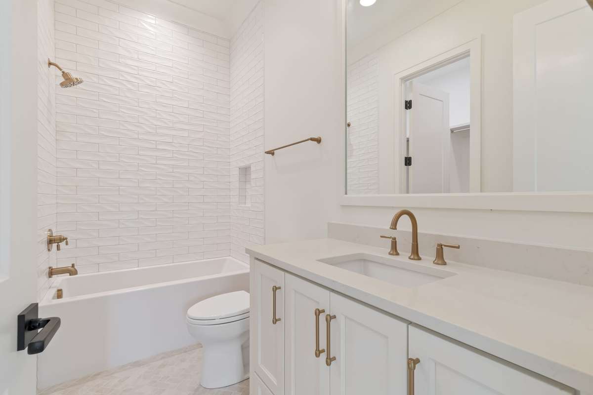 One of three secondary bathrooms upstairs. All bedrooms are ensuite and have generously-sized walk-in closets.