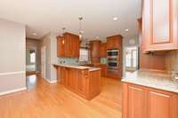 Updated kitchen with cherry cabinets, granite and stainless appliances