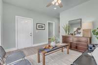 View of front door leading to the adorable front porch~