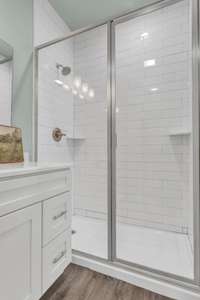 Walk-in tiled shower with sleek design ~