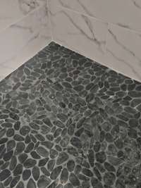 Tile floor in primary shower